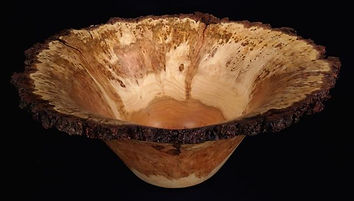 cherry burl bowl turned on a lathe