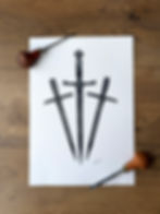 a lino print of 3 swords printed in black ink on white paper with lino walls framing the print