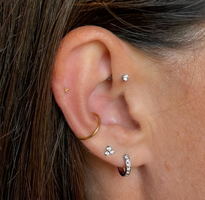 tasteful selection of ear piercings including gemstones