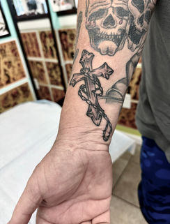 black and gray religious tattoo of a cross