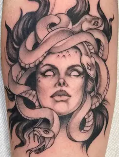 Black and grey Medusa tattoo with detailed snakes and smooth shading at Paramount Tattoo & Piercing in Fort Worth