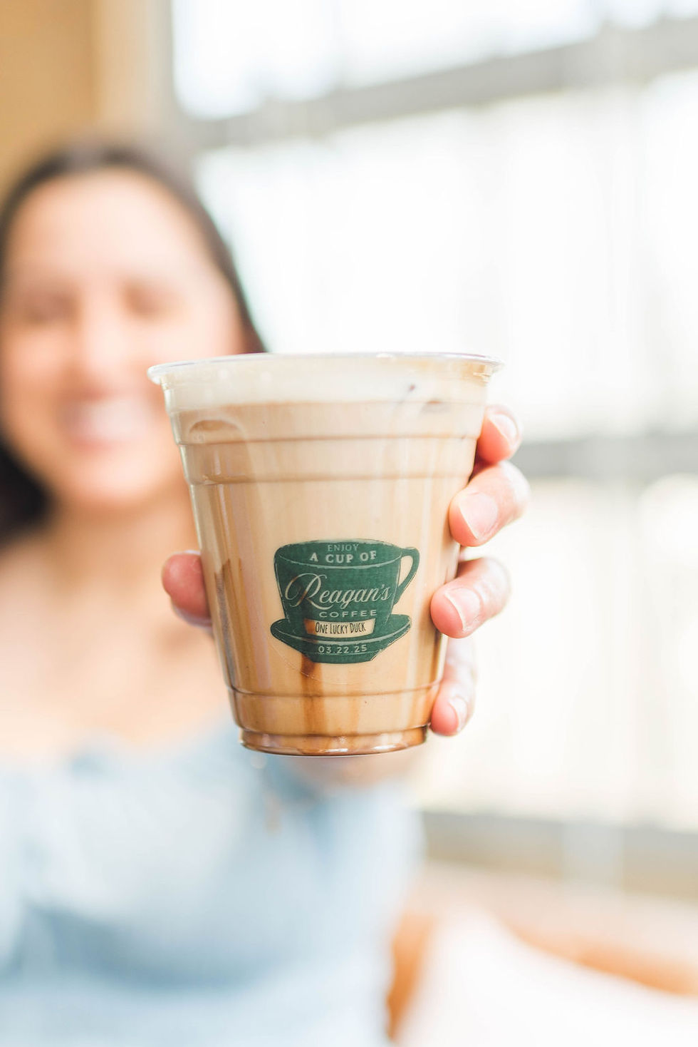 Girl holding custom branded cup for a birthday celebration