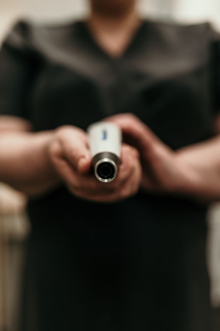 photo of Julie holding a Dermapen