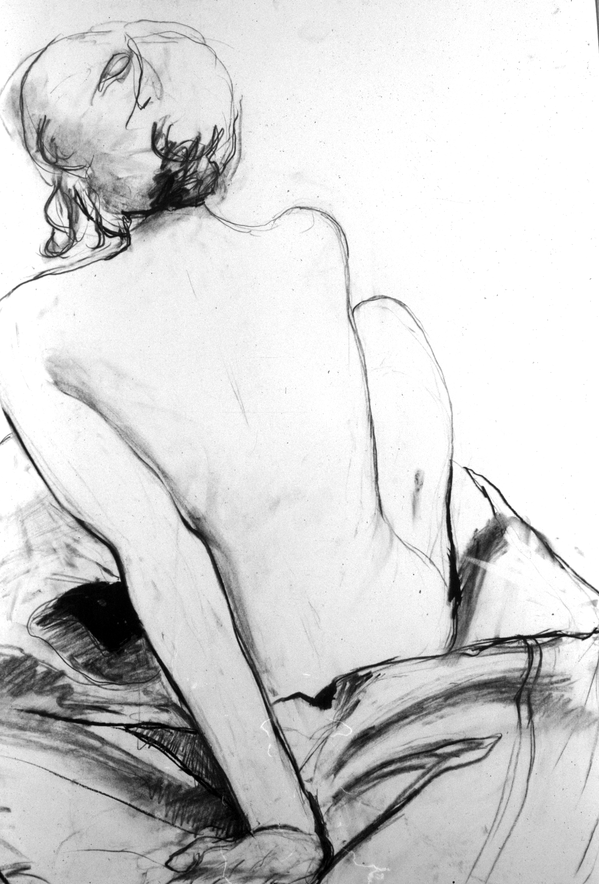 back of sitting figure