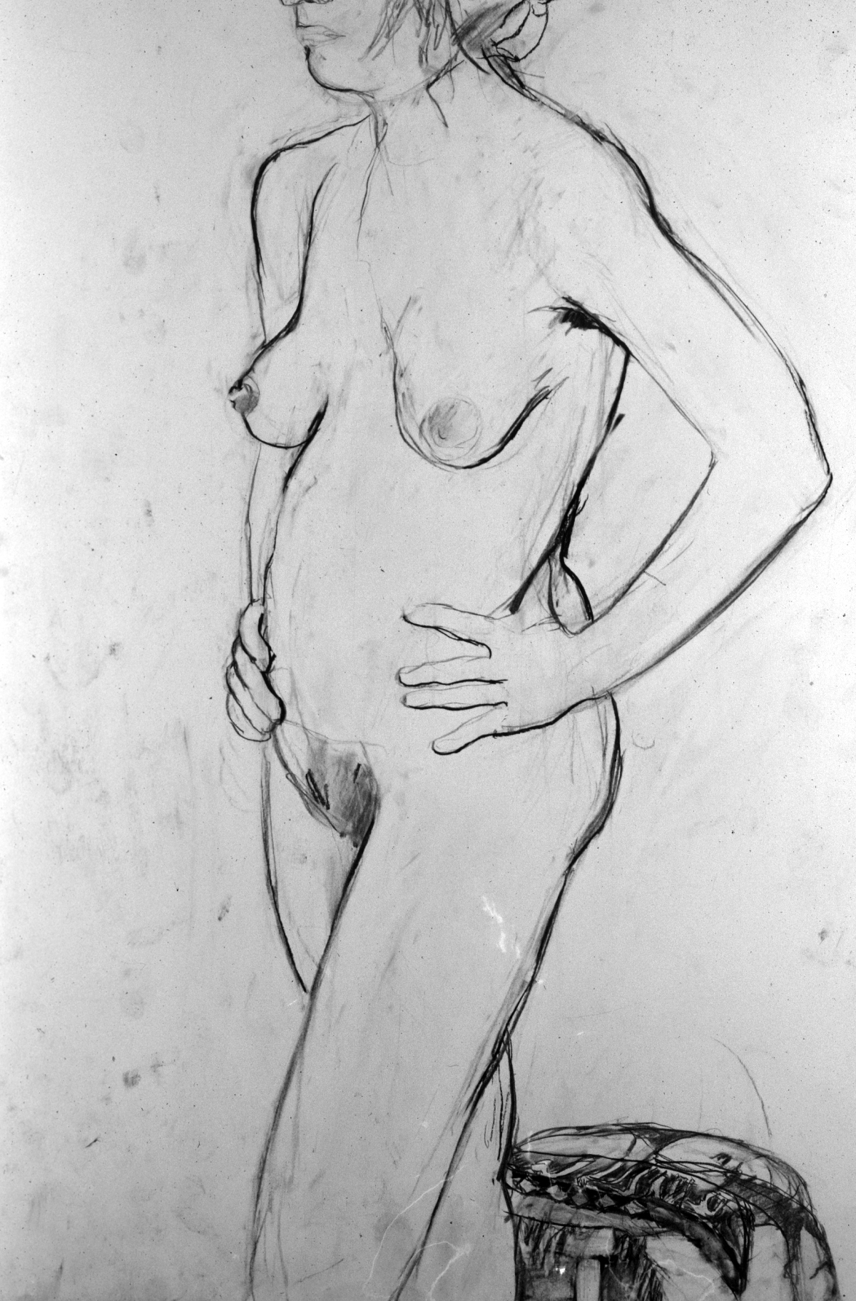 nude figure w hands on hips