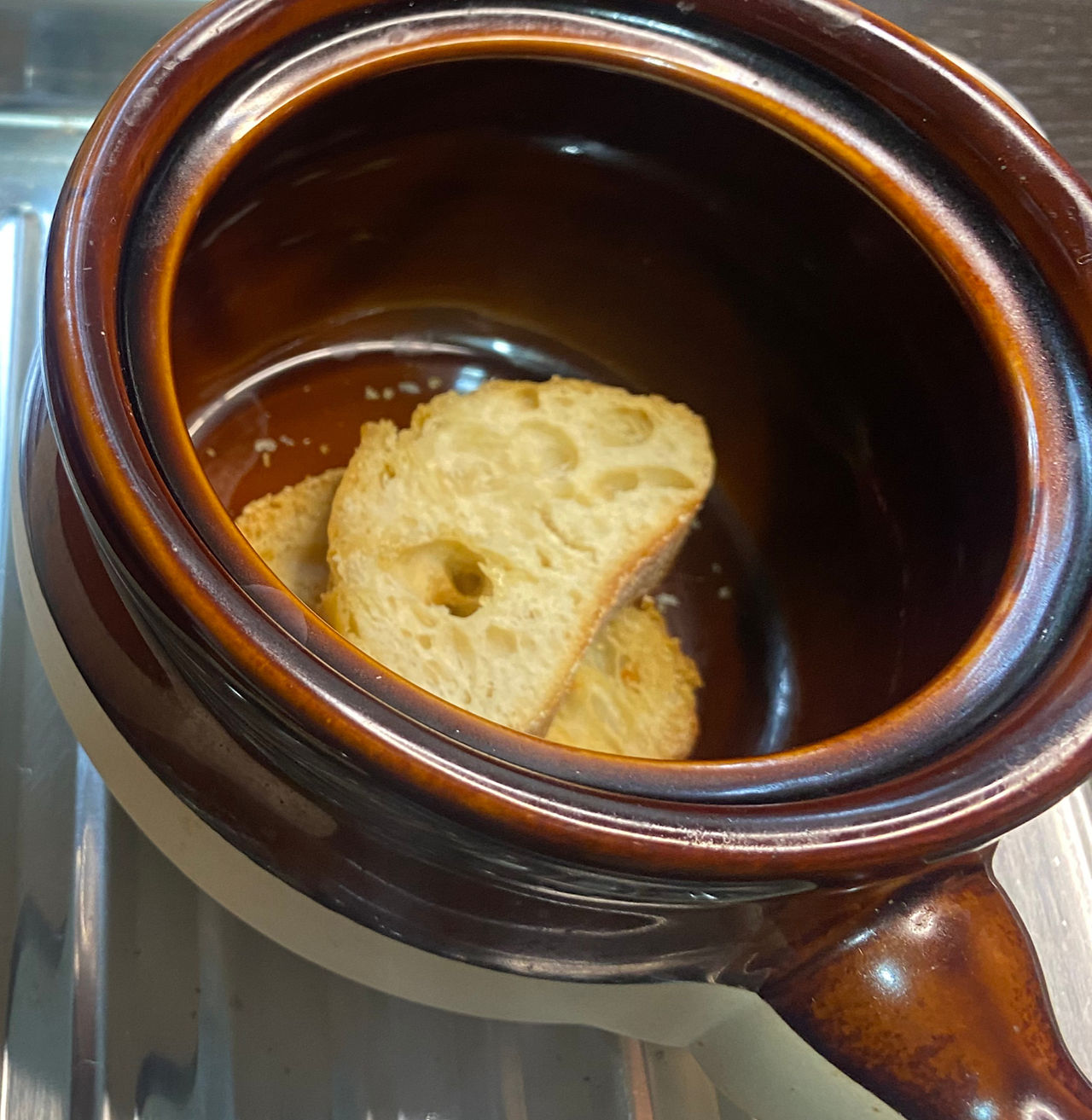 Place baguette slices in bottom of oven-safe bowl.