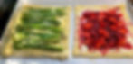Two puff pastry tarts on baking sheet ready to bake.