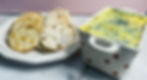Eye-level view of an inviting spread featuring chicken liver pâté alongside crusty bread