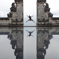 Man jumping at Gates of Heaven in Bali