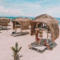 beach huts at le pirate island komodo indonesia