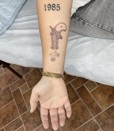 fine line gun tattoo