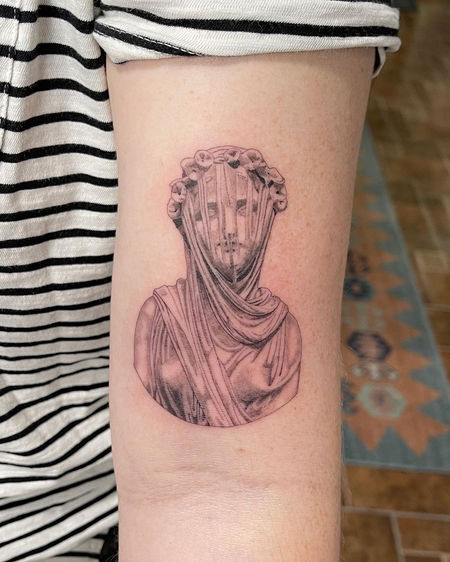 single needle statue tattoo
