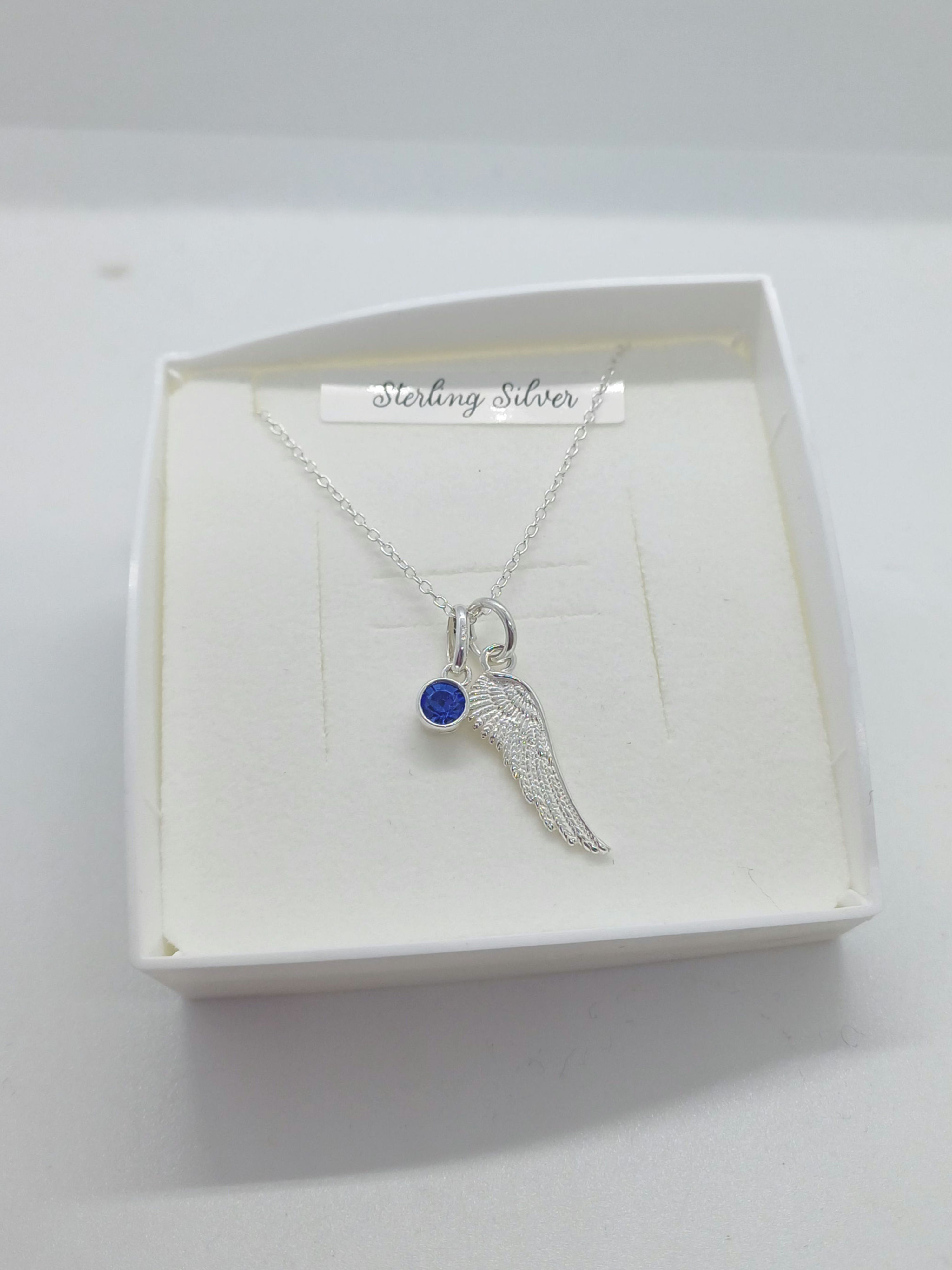 Silver wing and bezel charm pendant