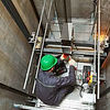 49915-lift-machinist-repairing-elevator-shaft-sstock_1448467451.jpg
