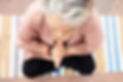 Theresa half lotus yoga pose close up Rishikesh.jpg