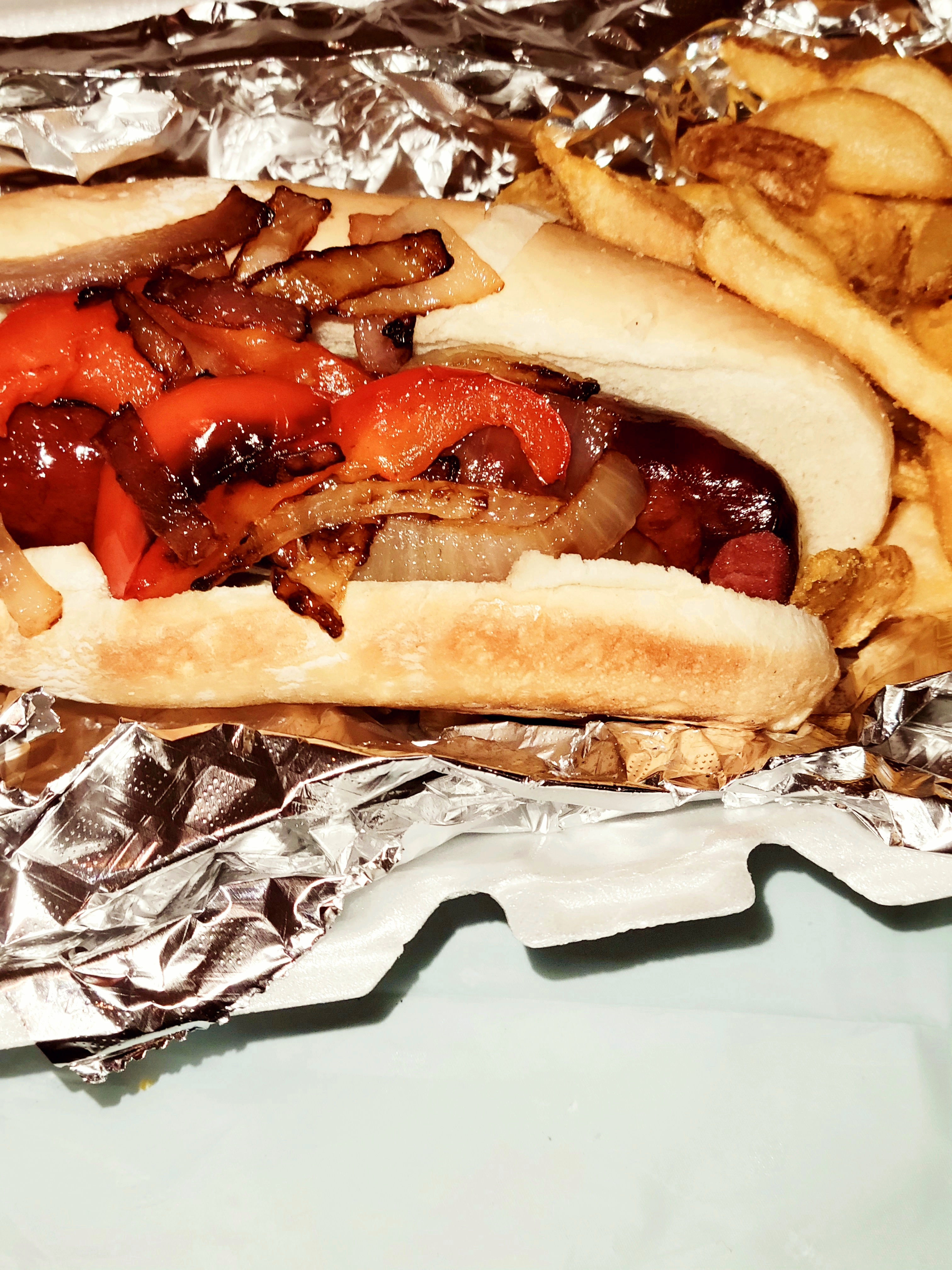 Polish sausage with freshly cut peppers&onions aserved our  hand cut fries 