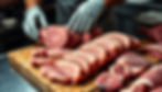 Eye-level view of a butcher displaying different cuts of pork