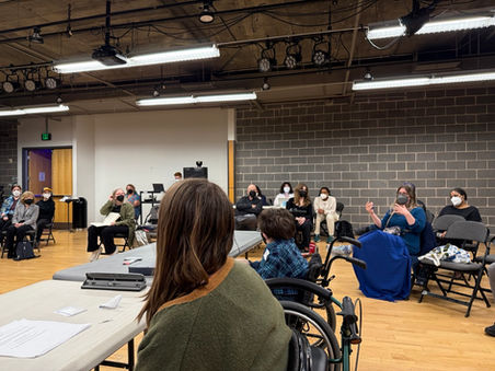 Audience discussing the script. A shot over the shoulder of the seated writers. We had about 35 people attend the event.