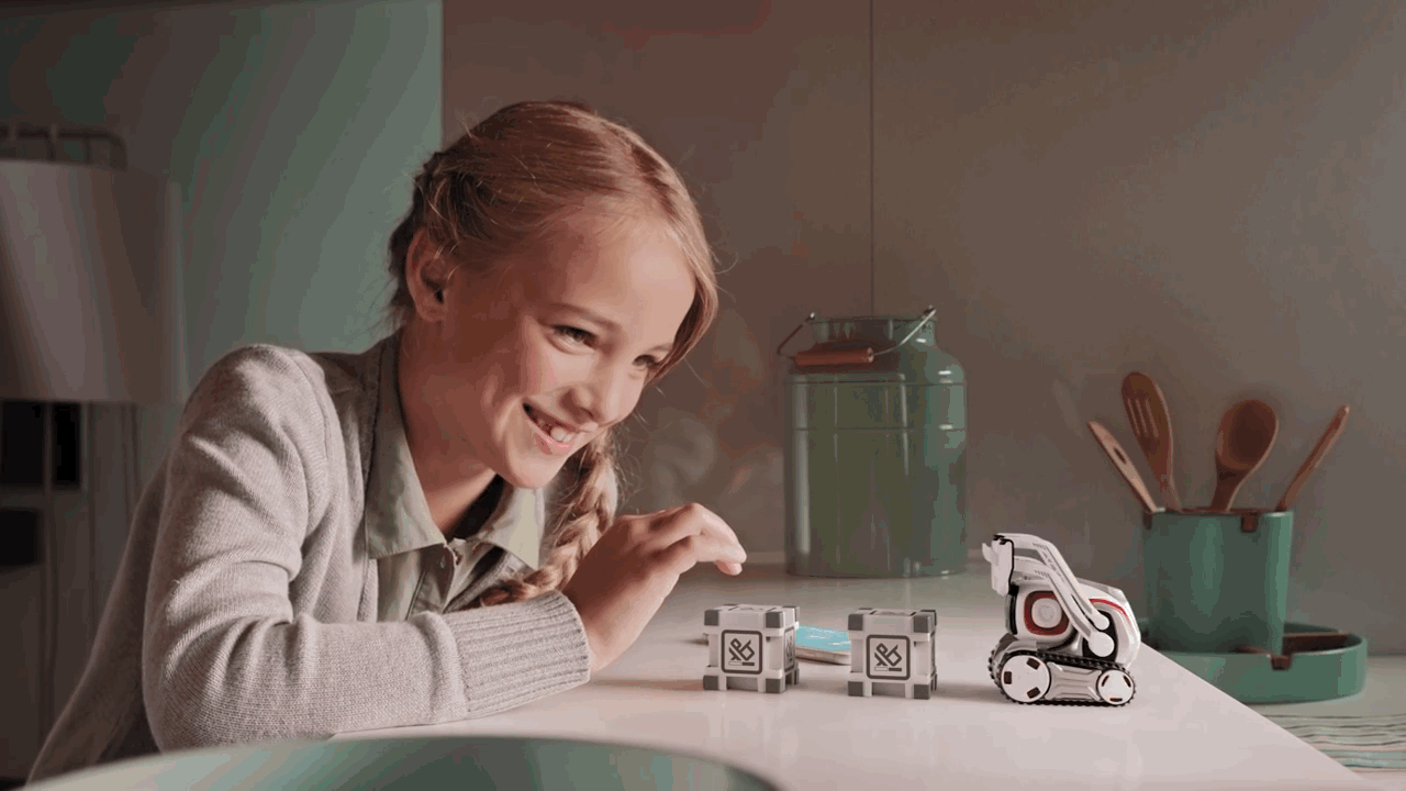 Cozmo the robot playing with a girl