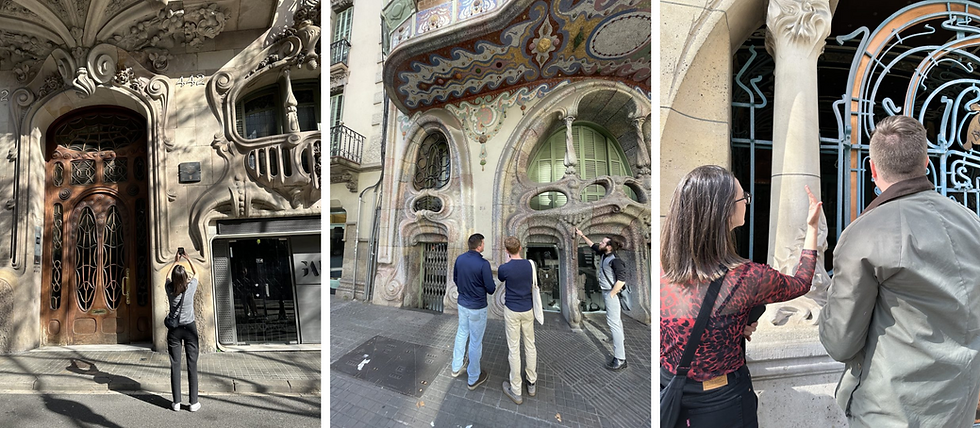 People admire ornate, curved architectural facades. One person photographs a wooden door, others gesture at intricate designs and columns.