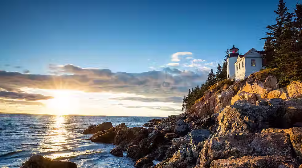 A lighthouse overlooks the ocean.