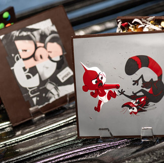 Chocolate Barks – Edna (white chocolate, dark chocolate, and chopped cookies ‘n cream cookies) and Jack-Jack (dark chocolate, milk chocolate, and mini chocolate chip cookies) featuring face of Pixar characters Edna Moda, Jack-Jack, and Rocky the Raccoon.
