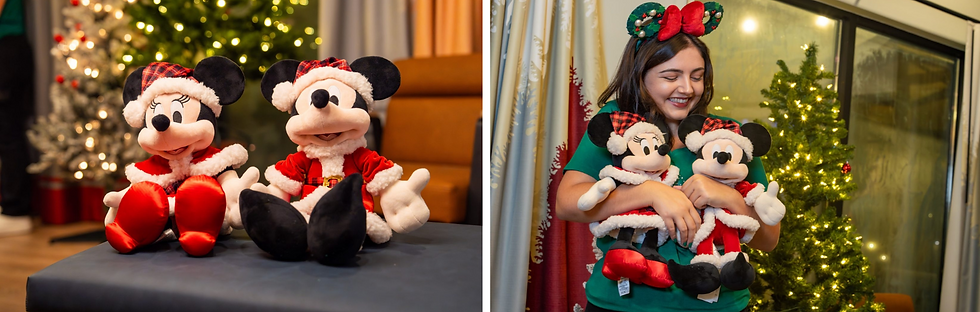 Plush Mickey and Minnie in festive attire sit on a table; a woman holds them joyfully by a Christmas tree, wearing a matching headband.