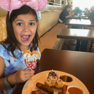 A girl is excited with her meal.
