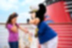 Girl in purple laughs with Captain Mickey Mouse onboard a ship. Mickey wears blue uniform, white hat. Background: red funnel, sky.