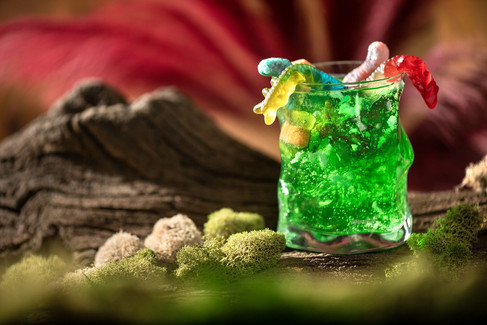 Slimy Yet Satisfying – Sprite infused with lime gelatin and garnished with centipede and worm gummies