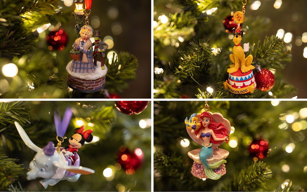 Four colorful Christmas ornaments on a lit tree: a chimney scene, Pluto on a circus stand, Minnie on Dumbo, and Ariel with Flounder.