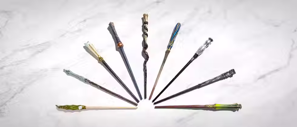 A series of wands on a granite countertop.
