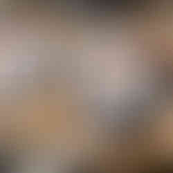 Shortbread Cookie with vanilla frosting, dulce de leche filling, and chocolate décor featuring face of Pixar character, Edna Mode.