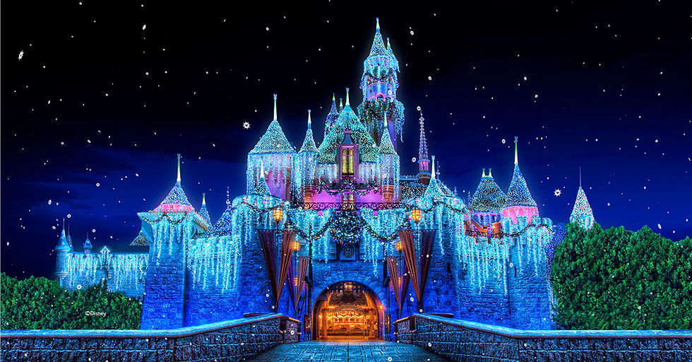 Snow-covered castle decorated with blue and white lights at night, under a starry sky. The scene is festive and magical.