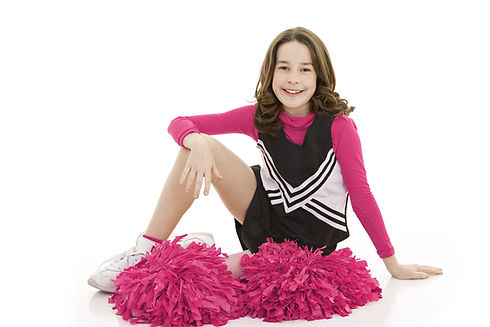Girl cheerleader sitting on floor with pink pom-poms