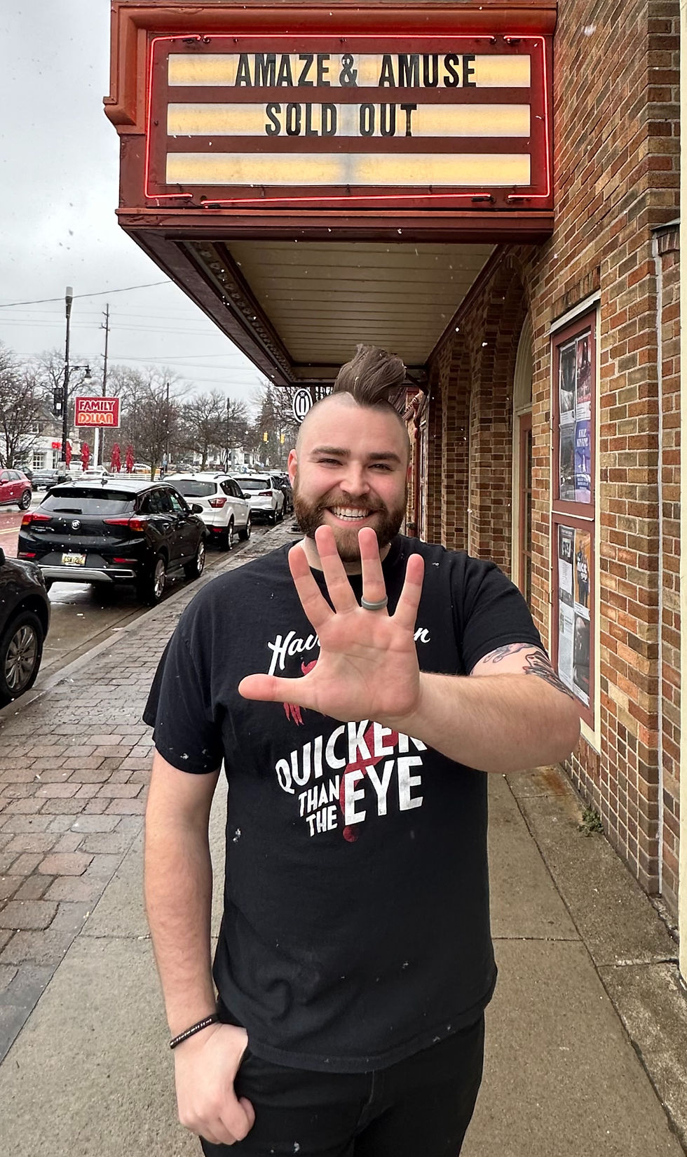 Trino holding 5 fingers up in front of SOLD OUT sign at Wealthy Theatre