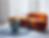 A sofa in bold burnt orange with textured fabric