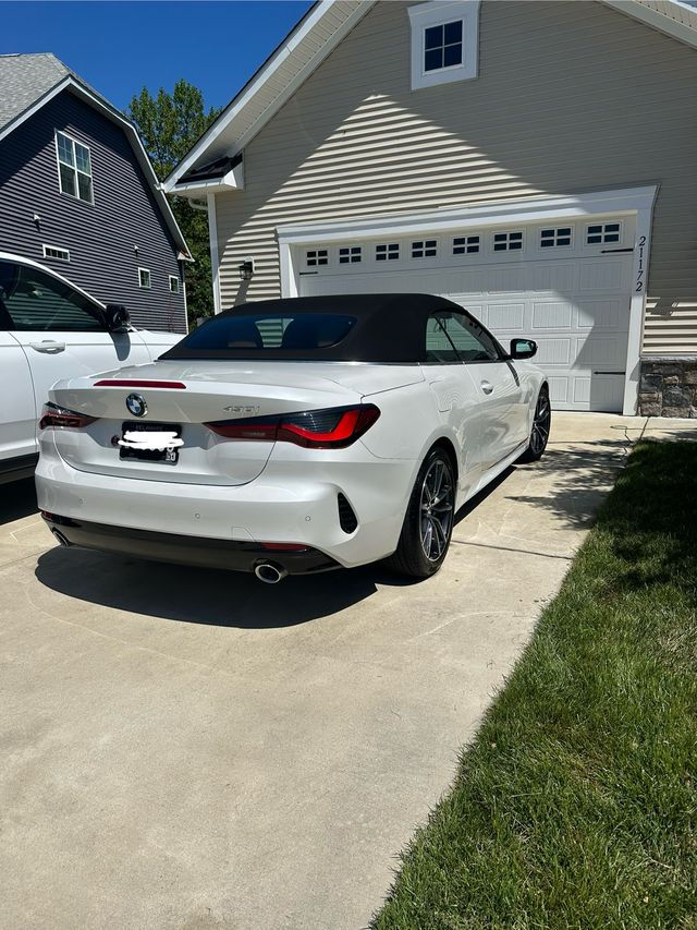 Clean white BMW convertible reflecting high-end mobile detailing results
