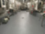 clean and sanitary industrial production facility with concrete flooring installed professionaly by indue