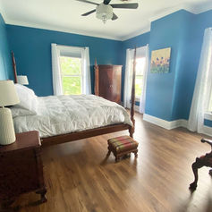 Blue decor room with large four post bed