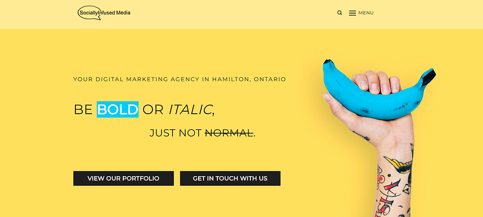 Yellow webpage hero with tattooed hand holding a blue banana beside text: Be Bold or Italic, just not normal.