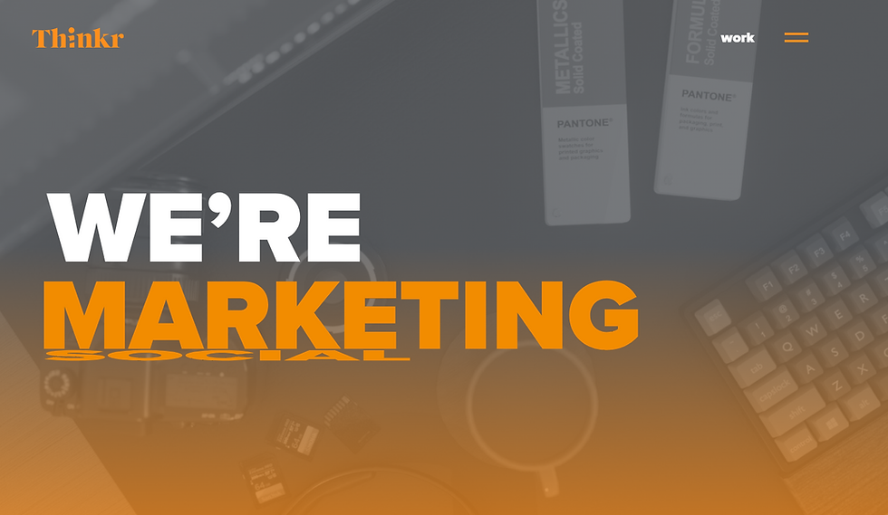 Thinkr marketing webpage hero with desk items, Pantone swatches and keyboard; bold WE’RE MARKETING SOCIAL text in orange and white.