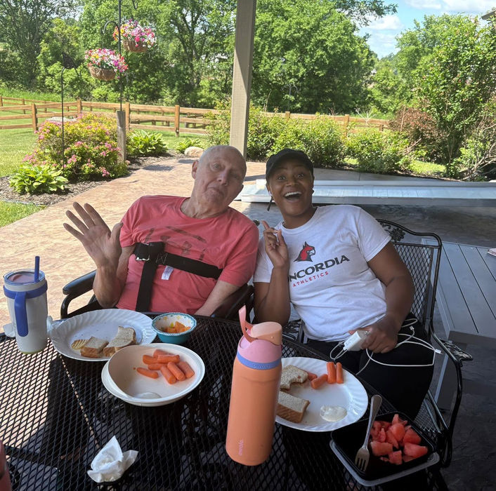 Residents enjoying a family-style meal together at Anchored Heart Residential Assisted Living in Goodrich, Michigan.