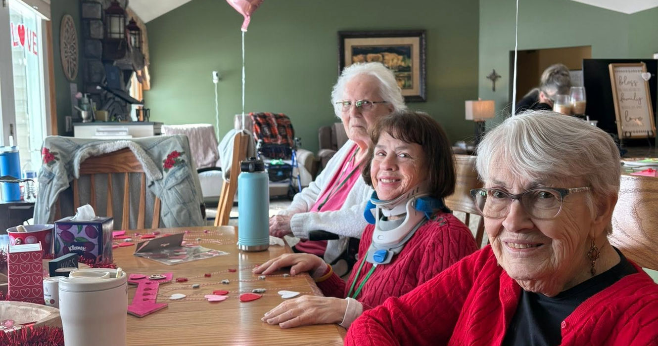 Resident participating in a Valentine's Day celebration and social activity.