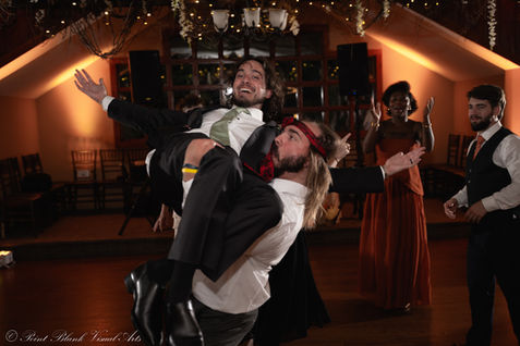 groom dancing with friend