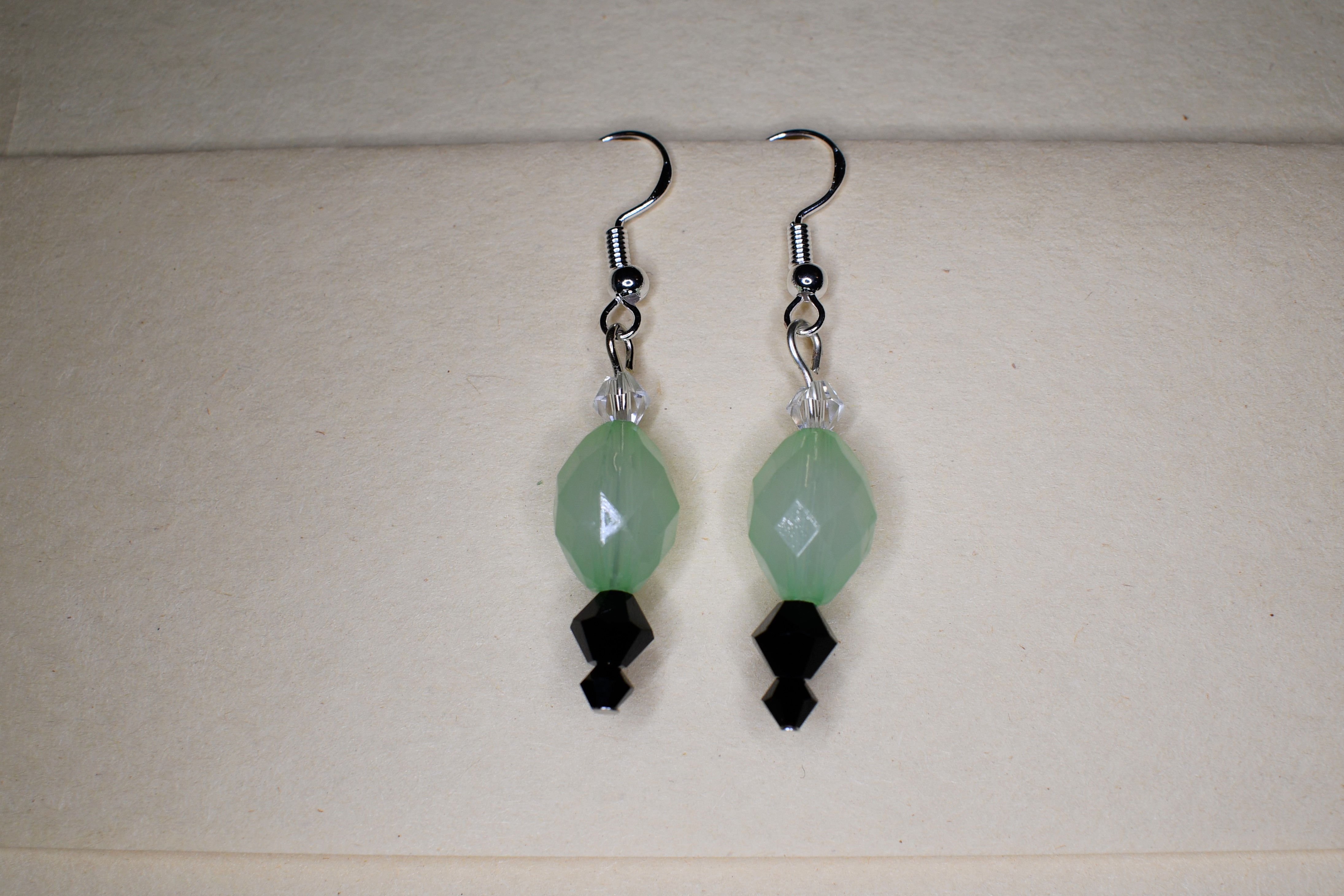 green & back beaded earrings