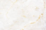 close-up-of-a-white-marble-textured-wall.jpg
