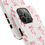 Thumbnail: Pink ribbon pattern on a white iPhone case, close up view showing design.