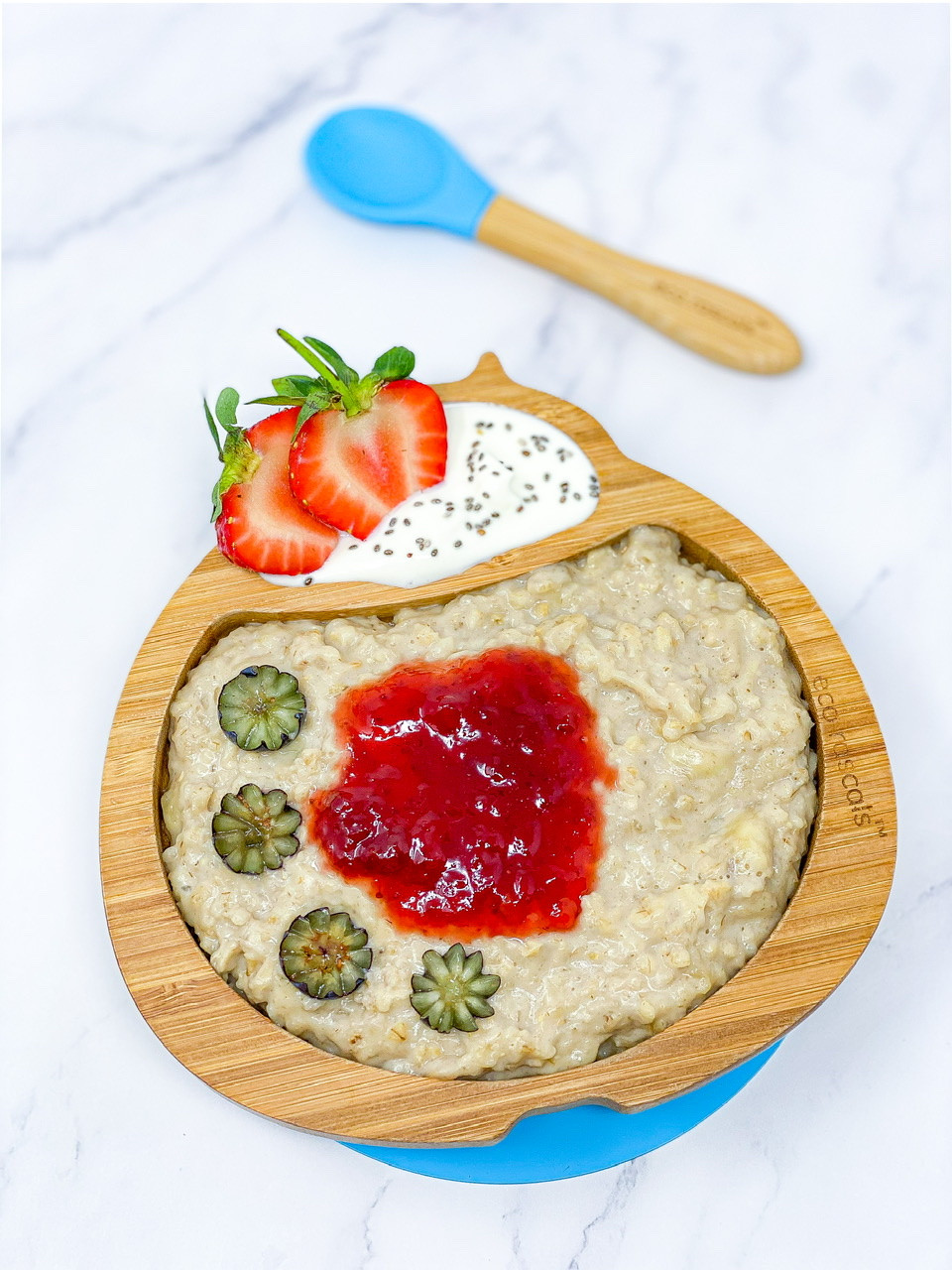 SIMPLE BANANA & PEANUT BUTTER PORRIDGE with jam on top served in bamboo plate