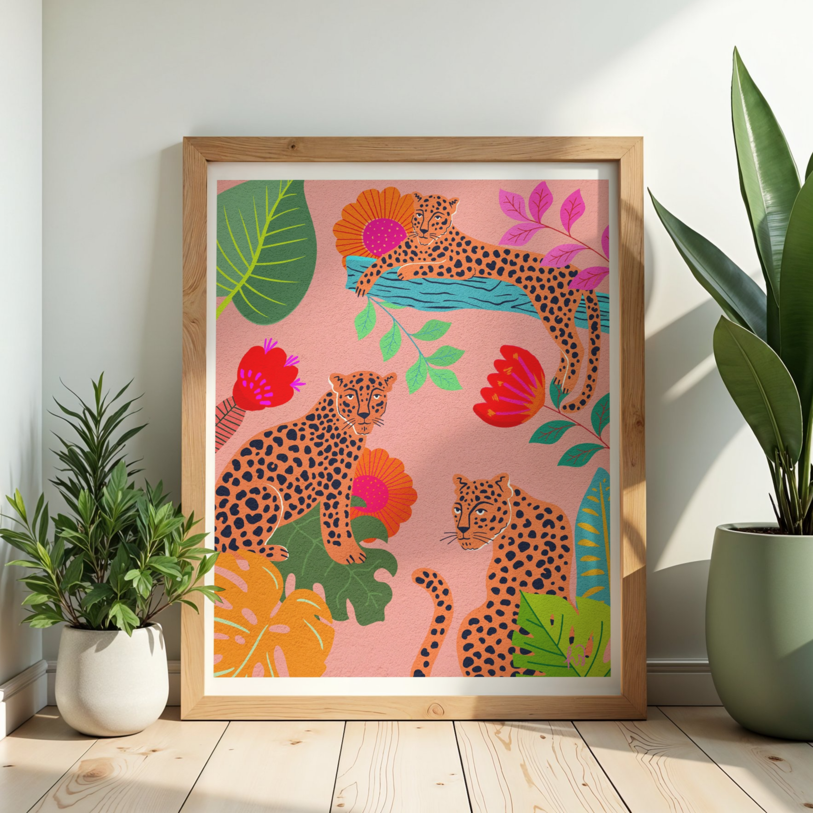 Cheetah Feast art print with three colorful cheetahs surrounded by flowers and tropical leaves on a light pink background